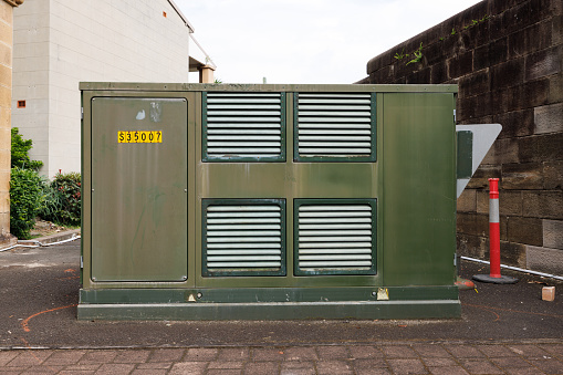 Green metal box with vents.