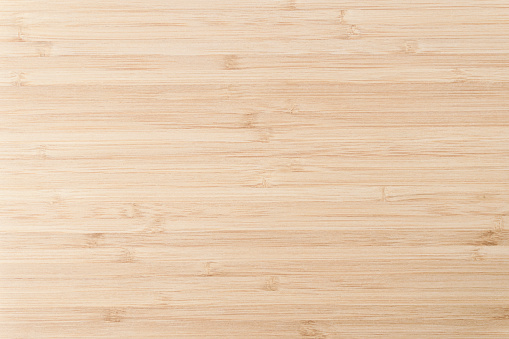 Bamboo wood surface with texture and pattern. Light bamboo background for decorating furniture, walls, floors, tables, interiors.