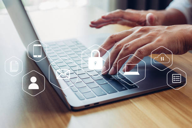 istock Man hand working digital marketing media in virtual screen laptop with cyber security, digital crime concept 1368151414