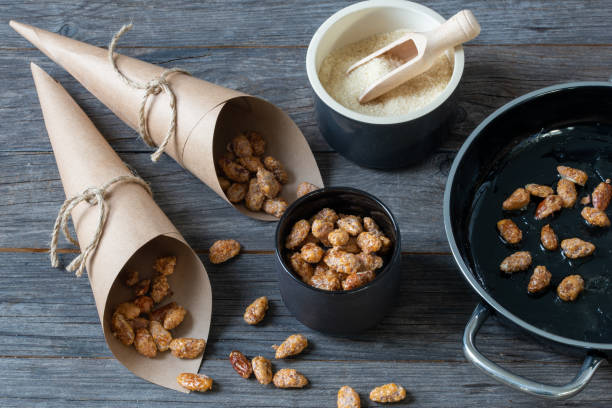 istock roasted almonds, sweets in candy paper bags 1368152592