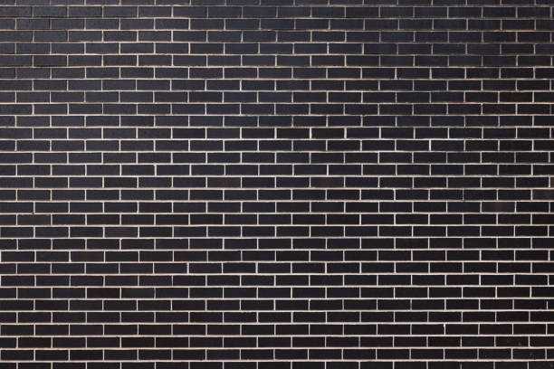 istock Part of a dark brick wall 1368154357