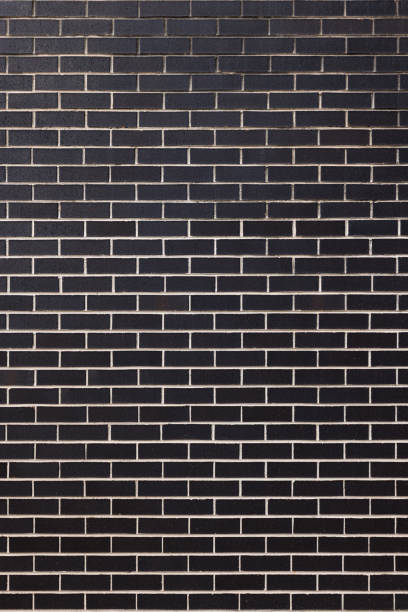 istock Part of a dark brick wall 1368154717