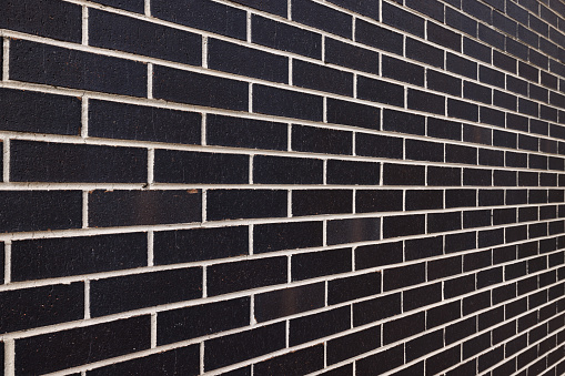 new red brick building with blue blinds, full frame