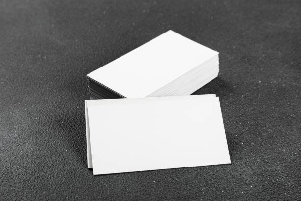 istock Business cards blank. Mockup on black background. Copy space for text. 1368155744