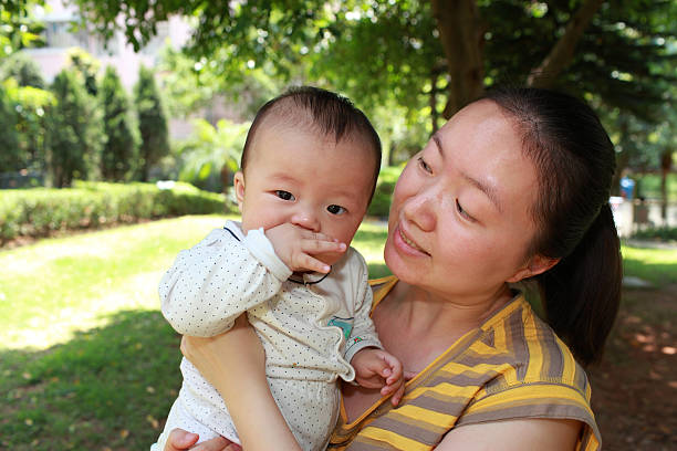 istock Happy Asian mother and son in sunlight 136815606