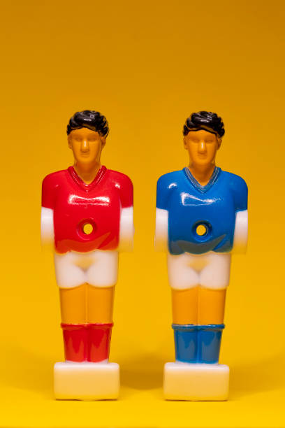 istock Table soccer figure isolated on yellow background 1368157682