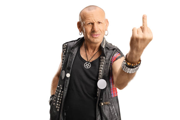 istock Punk showing a middle finger and smiling 1368157946