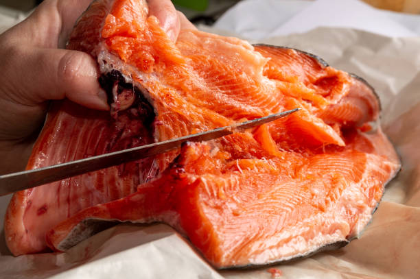 istock cook cuts trout into fillets 1368158398
