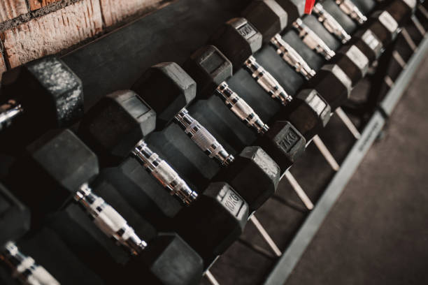 istock Dumbbell row on a shelf in the gym 1368159538