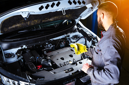Checking the engine oil level. Auto Repair Shop or Auto Service.