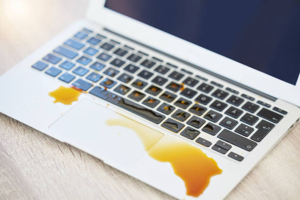 istock Shot of a laptop with coffee spilled on it 1368161878