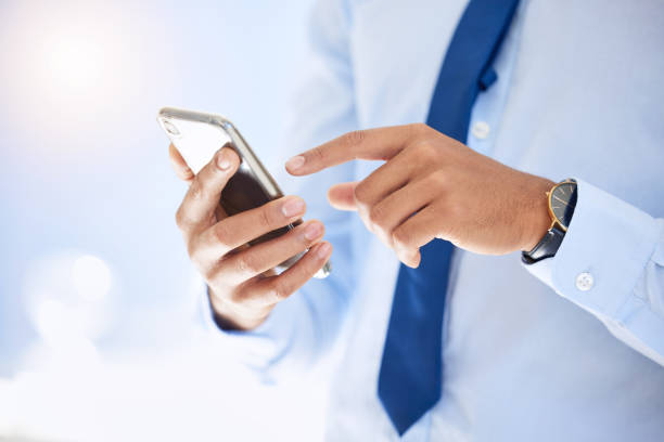 istock Shot of a businessman using his smartphone to send a text message 1368163151