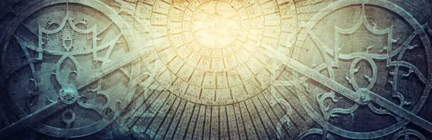 Photo of Ancient astronomical instruments on vintage paper background. Abstract old conceptual background on history, mysticism, astrology, science, etc. Retro style.