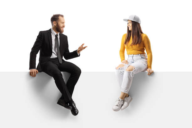 istock Businessman sitting on a panel and talking to a young trendy female 1368163686