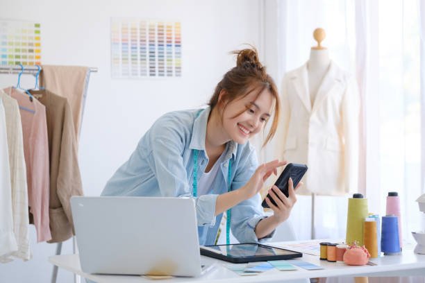 istock Fashion designer working in studio 1368163818