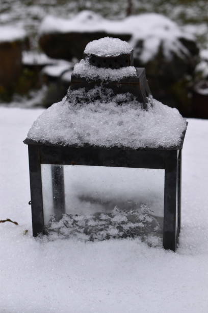 istock A lantern with snow and in snow. 1368163840