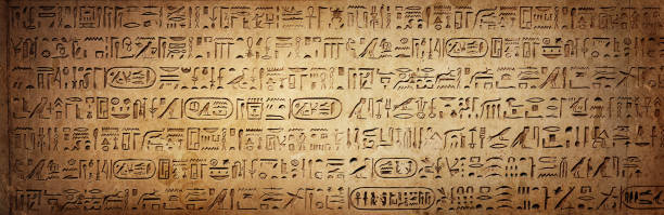 istock Old Egyptian hieroglyphs on an ancient background. Wide historical background. Ancient Egyptian hieroglyphs as a symbol of the history of the Earth. 1368164452
