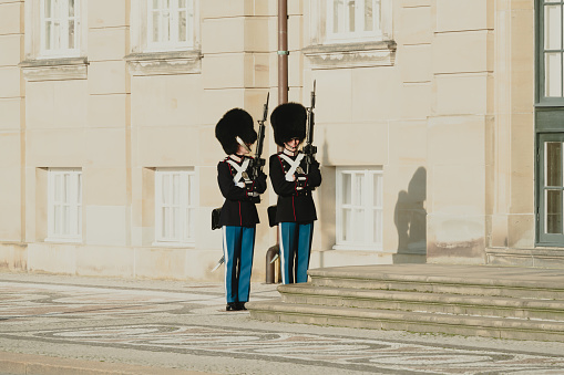 Copenhagen, Denmark - Oct. 28th 2021: Royal guard standing watch by the residence of the Danish Royal family at Amalienborg Palace in Copenhagen.