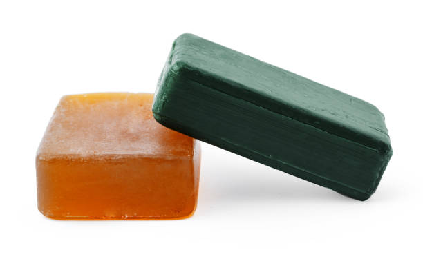 istock Beige and green soap bars on white background 1368167891