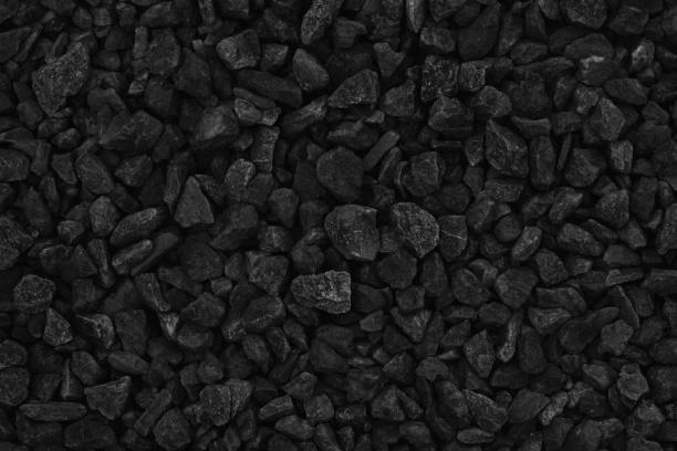 istock Natural pebble rock pattern for background, black and grey gravel stone texture. 1368168713