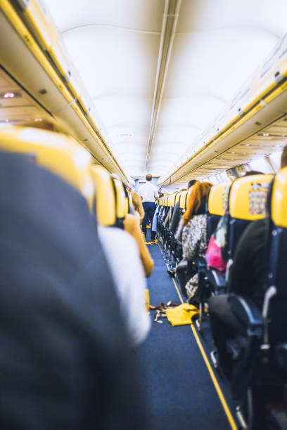 パリ、フランス - 10月 06, 2019: 旅客機に乗ってライフジャケット - commercial airplane airplane cabin passenger ストックフォトと画像