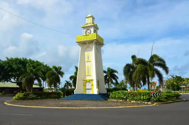 Apia, Samoa: clock tower, erected in 1920 as a World War I memorial, chimes every quarter hour, gifted to Samoa by Ta'isi Olaf Frederick Nelson - flowery roundabout on Beach Road.