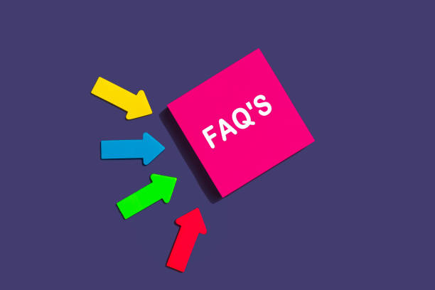 istock FAQ frequently asked questions - concept of text on sticky note. Pink square sticky note and colorful arrows on purple background, top view 1368171519