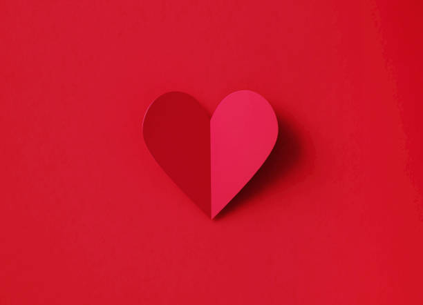 istock Valentine's Day Concept - Folding Red Heart Shape Over Red Background 1368171800