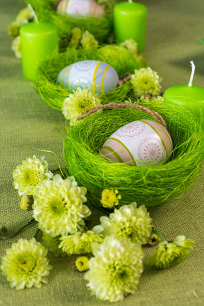 istock Set table with Easter decoration - eggs in nests and flowers. 1368174736