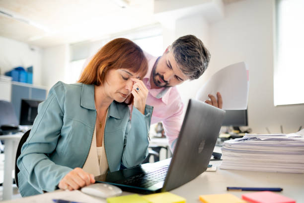 istock Stressed out businesswoman being harassed by her manager at work 1368174833