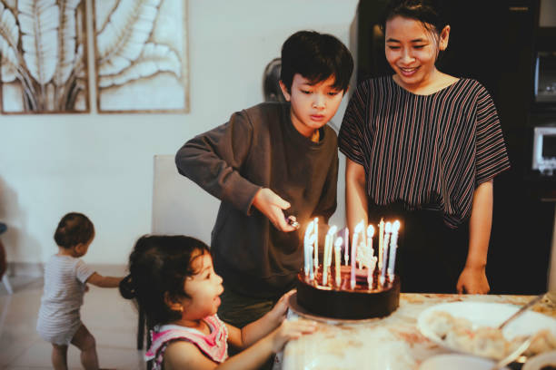 istock young kid decorating cake for birthday party 1368176975