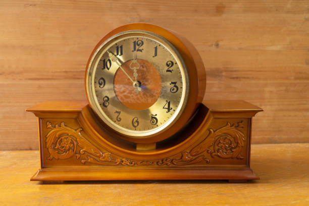 istock Vintage wooden mechanical clock on the shelf 1368177008