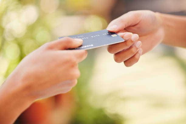 istock Shot of a customer using a card to make a payment 1368179240