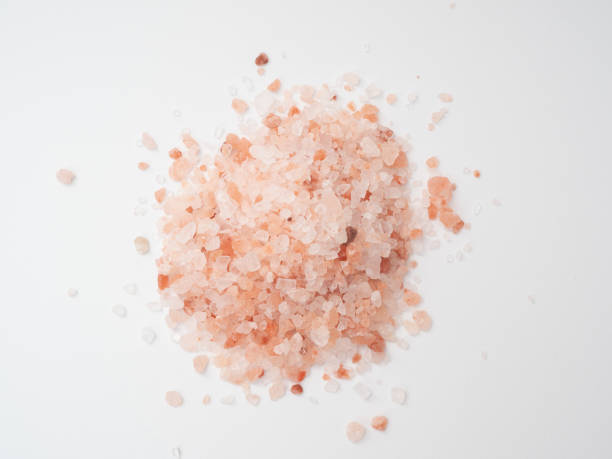 istock Pink salt on a white background 1368179282