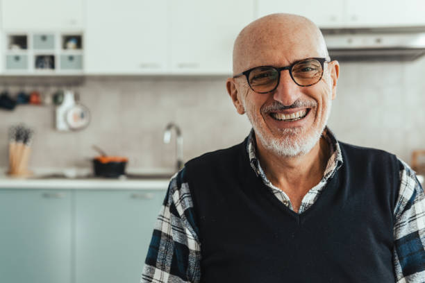 istock Portrait of a middle aged man looking into the camera - copy space on the left 1368180628