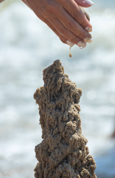 istock sandcastle on the beach near the water. 1368181618