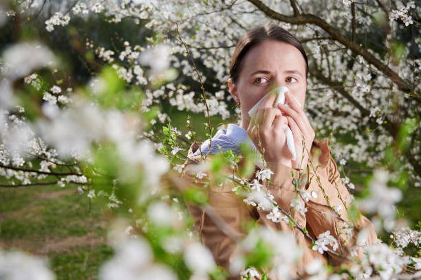 istock Woman allergic suffering from seasonal allergy at spring. 1368183032
