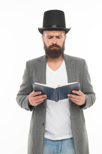 istock I have to study. Gentleman in top hat read study book. Bearded man isolated on white. Back to study. Return to education. Private teaching. Private lesson. Study of poetry. School for life 1368188357