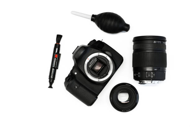 istock LSR camera with lens and camera cleaning kit on white background top view 1368188450