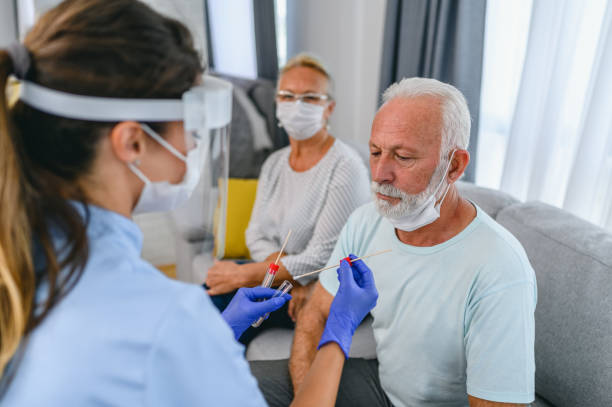 istock Female doctor taking a nose swab test from a senior man for COVID-19 testing testing 1368189599