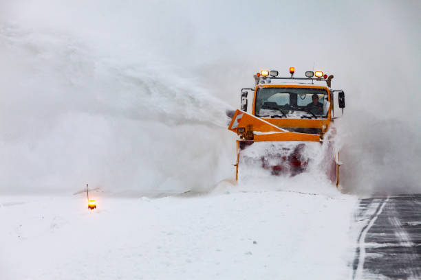istock Snow plows on the runway in a snowstorm 1368189717