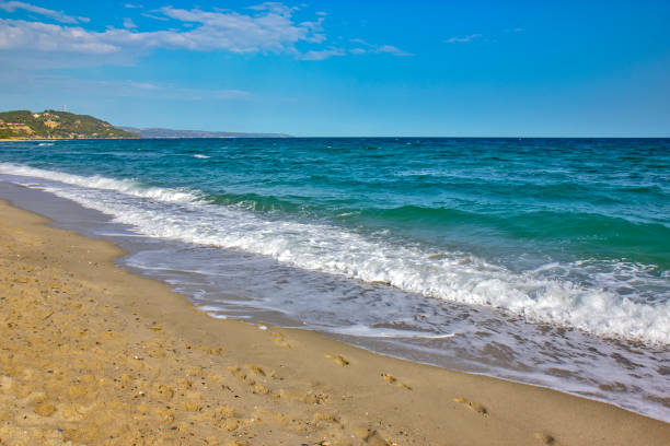 Detail from sandy Possidi cape beach in Greece