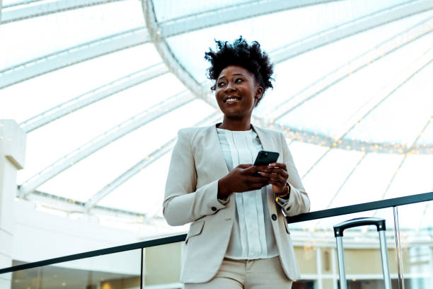 istock Young businesswoman using mobile phone 1368191852