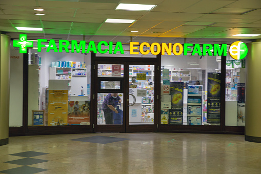 Bucharest, Romania - August 12, 2021: People visit Econofarm pharmacy in downtown.
