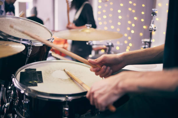 istock Shot of an unrecognizable drummer playing drums during a band practice at home 1368194993