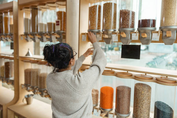 istock Young Female Refilling A Reusable Jar In A Sustainable Store 1368195154