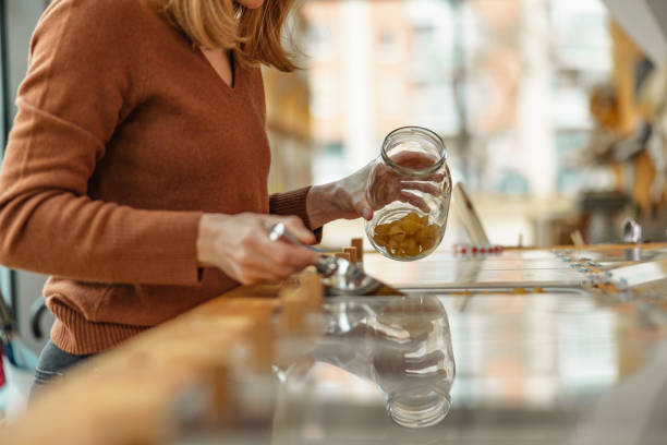 istock Caucasian Female Refilling A Reusable Jar In A Sustainable Store 1368195189