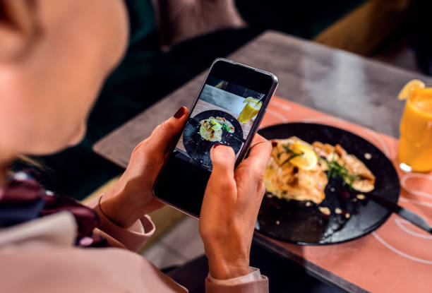 istock Businesswoman having lunch in restaurant. 1368196103