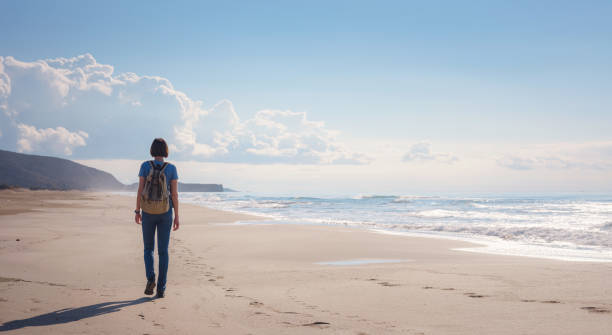 istock Backpacker asian female on Patara sand dunes beach 1368196166