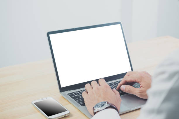 istock Man hands writing on laptop, isolated on white 1368196299